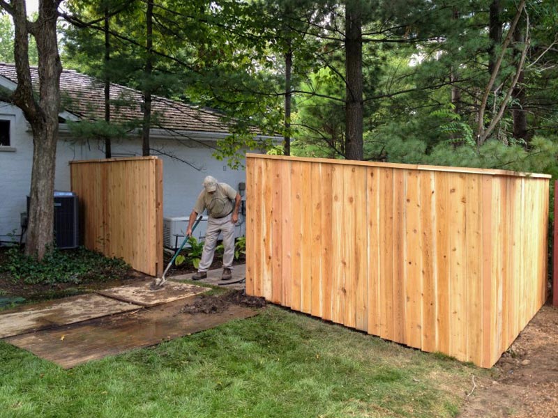 Action Fence of Michigan installing a fence post